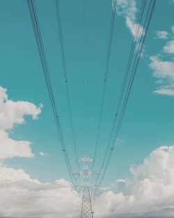 Low angle view of electricity pylon against sky