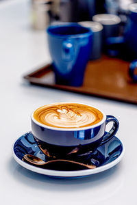 Close-up of cappuccino on table