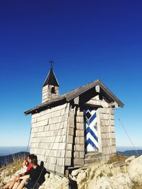 Low angle view of built structure against clear blue sky