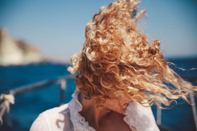 Close-up of woman with tousled hair