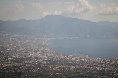 Scenic view of mountains and lake against sky