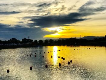 Scenic view of lake against sky during sunset