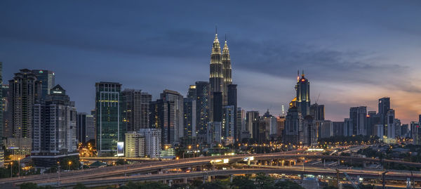 Illuminated skyscrapers in city at night