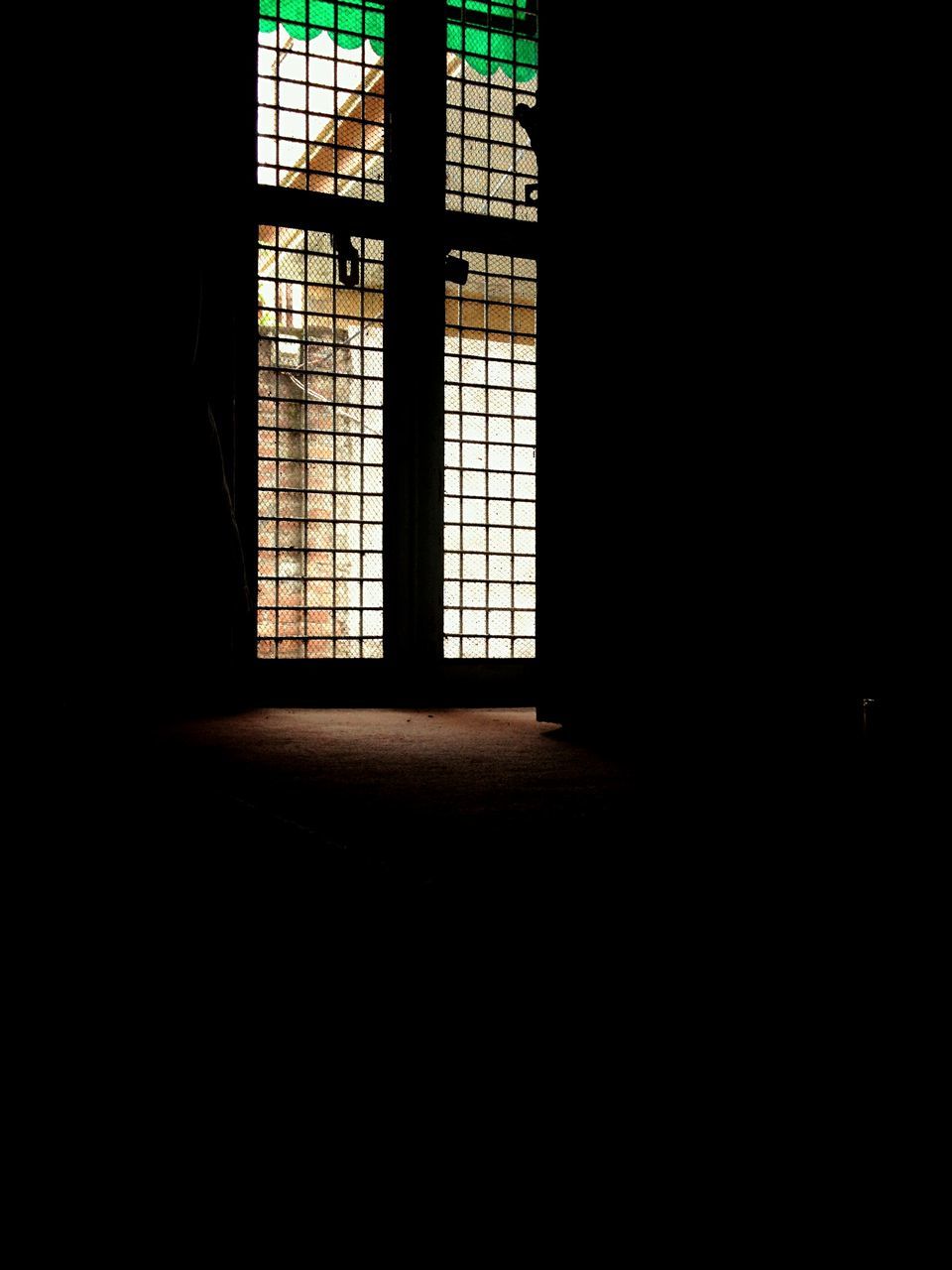 indoors, window, architecture, built structure, dark, shadow, door, sunlight, wall - building feature, home interior, house, closed, corridor, doorway, illuminated, entrance, wall, building, darkroom, no people