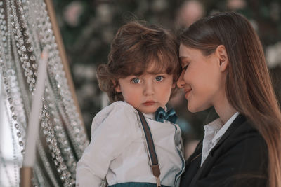 Portrait of mother and daughter outdoors