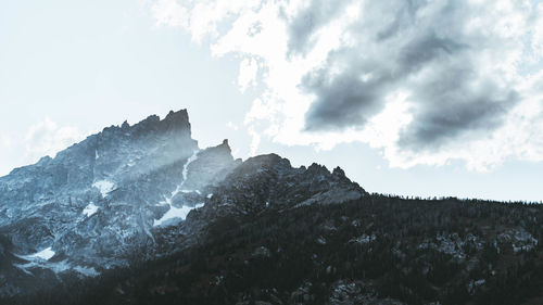 Low angle view of majestic mountains against sky