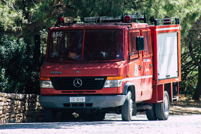 Red truck on street in city