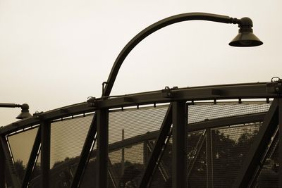 Low angle view of metal structure against sky