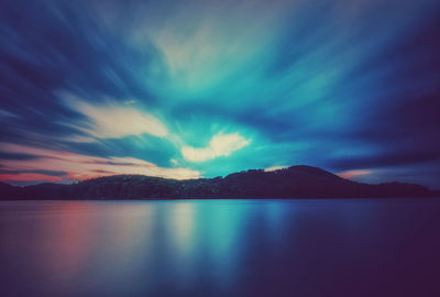 Scenic view of calm lake against sky