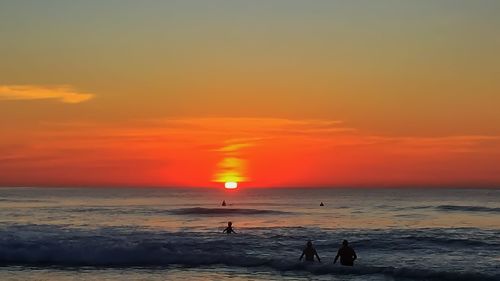 Scenic view of sea at sunset