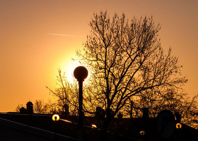 Low angle view of silhouette tree against sky during sunset