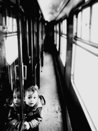Boy standing in train