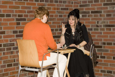 Young woman sitting on chair