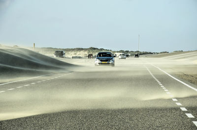 Car on road against clear sky