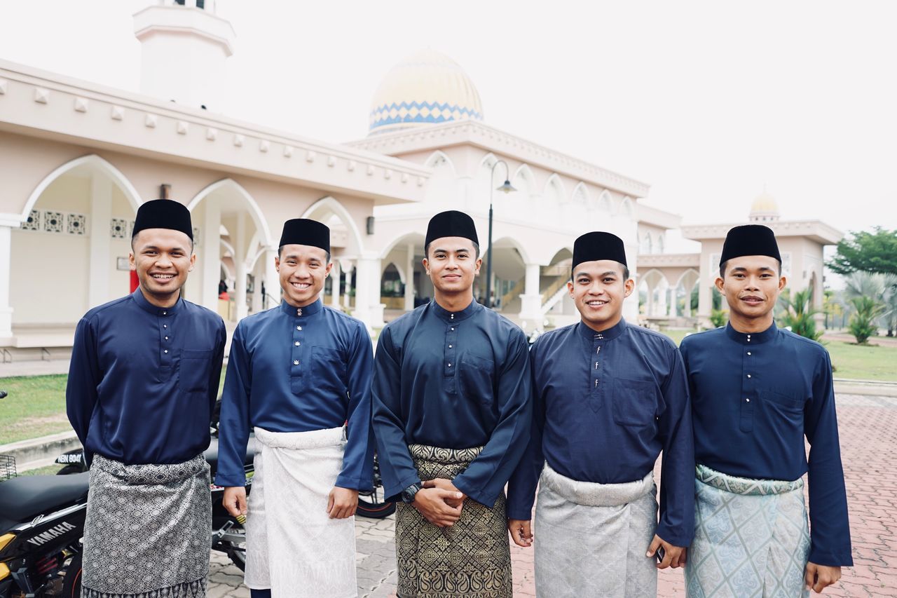 looking at camera, portrait, smiling, men, group of people, real people, emotion, standing, young men, young adult, happiness, males, people, day, clothing, front view, occupation, confidence, togetherness, teamwork, uniform, government