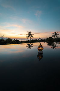 Scenic view of lake against sky during sunset