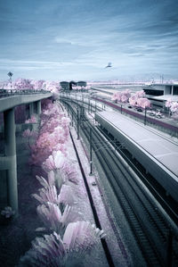 Train on railroad tracks against sky