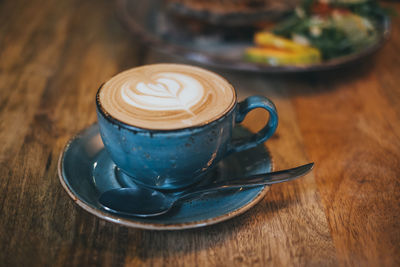 Close-up of cappuccino on table