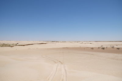 Scenic view of desert against clear sky