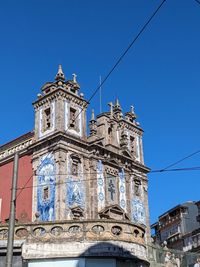 Low angle view of cathedral against clear blue sky