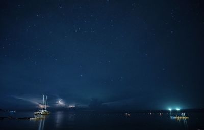 Scenic view of sea against sky at night