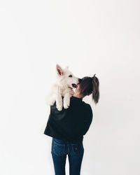 Man with dog against white background