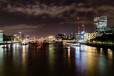 Illuminated city at waterfront