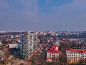 High angle view of buildings in city against sky