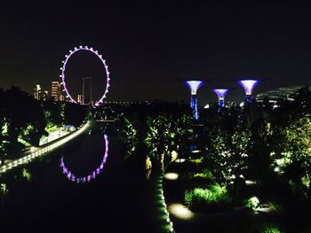 Illuminated flower tree against sky at night