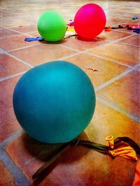 Colorful balloons on wooden floor