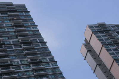 Low angle view of modern buildings against clear sky