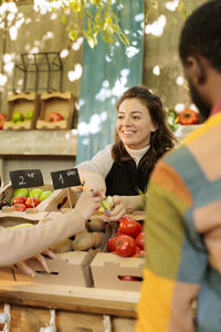 Portrait of young woman preparing food