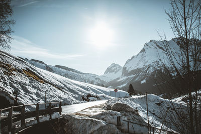 Scenic view of snow covered mountains against sky