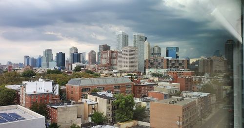 High angle view of buildings in city against sky