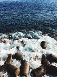 High angle view of rocks in sea