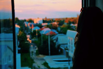 Close-up of mid adult man against sunset sky