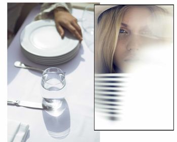 Portrait of woman with reflection on table