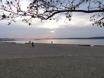 Scenic view of beach against sky during sunset