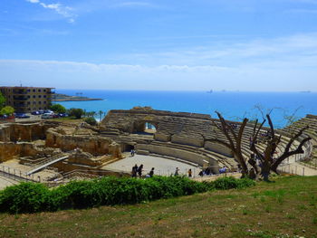 High angle view of sea by trees against sky