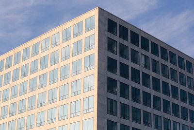 Low angle view of office building against sky