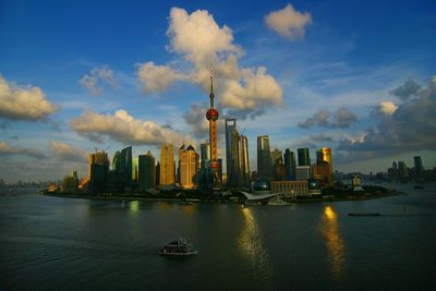 Panoramic view of buildings and city against sky