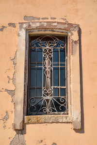 Low angle view of window on old building