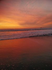Scenic view of sea against romantic sky at sunset