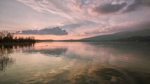 Scenic view of lake against sky during sunset