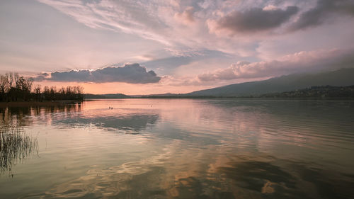 Scenic view of lake against sky during sunset