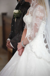 The hands of a bride and a groom