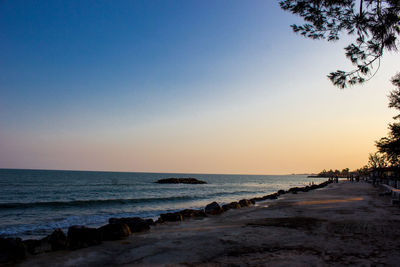 Scenic view of sea against clear sky during sunset