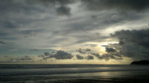 Scenic view of sea against sky at sunset