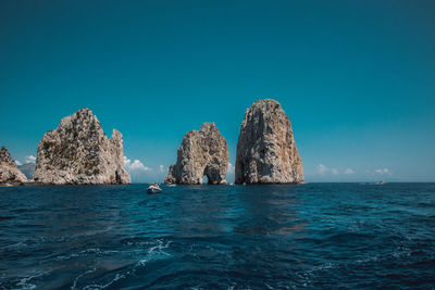 Panoramic view of sea against clear blue sky