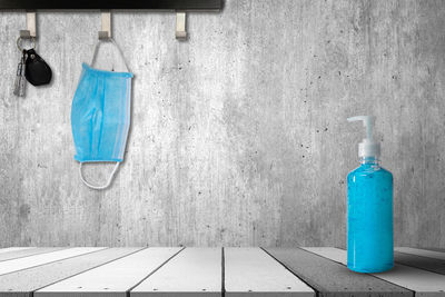 Blue paint hanging on wall